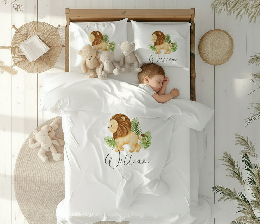 Children's bedding set with lion design and name 'William' in a bedroom setting.